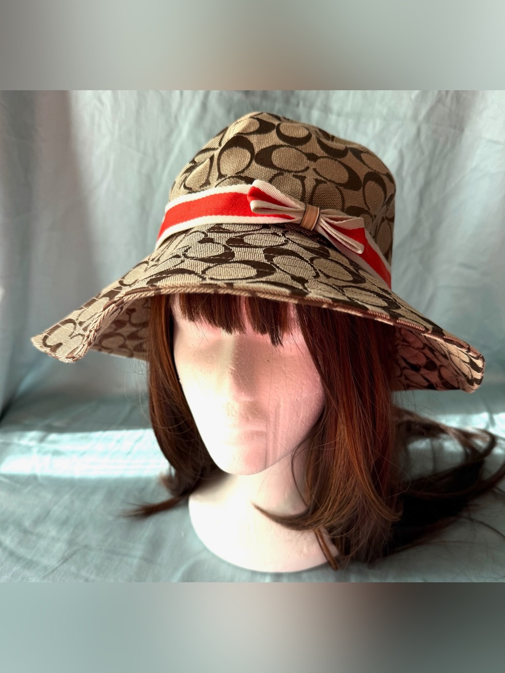Coach Beige Signature Canvas Bucket Hat with Orange & White Accent Bow
